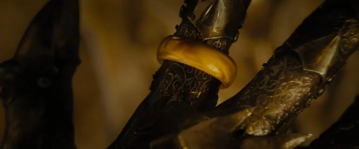 Still from Fellowship of the Ring: closeup of the One Ring on Sauron's armored finger.